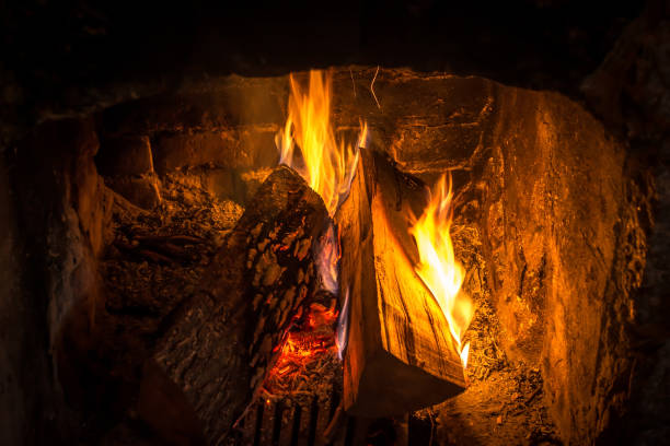istock Firewood burning in an old fireplace close up 1133377535