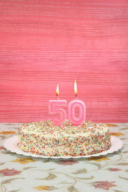 Her fiftieth birthday Birthday cake with number 50 candle for her birthday fiftieth stock pictures, royalty-free photos & images