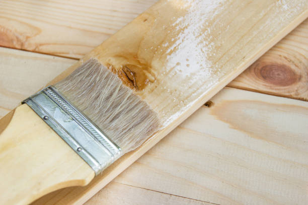 istock Paint brush with Shellac oil paint on wood 1133379045