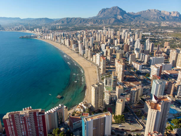 Aerial photo taken in Benidorm in Spain Alicante, showing the beautiful beach of Playa Levante and hotels, buildings, and high rise skyline cityscape. stock photo