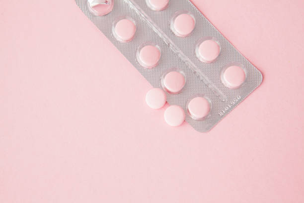istock Pink pills on a pink background, copy space 1133382051