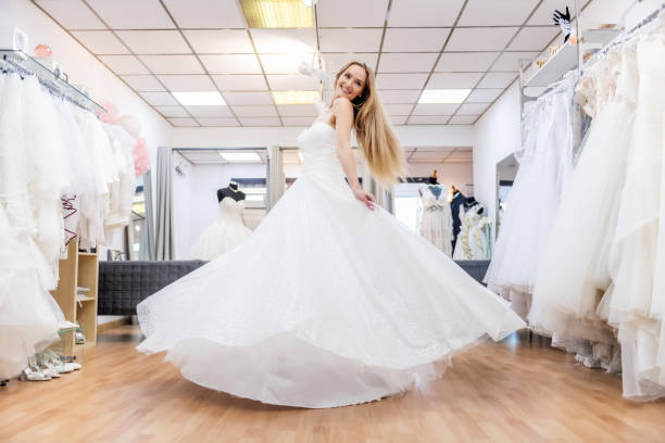istock Beautiful bride dancing in bridal shop 1133382329