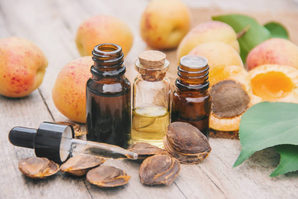 istock apricot oil in a small jar. selective focus. 1133382899