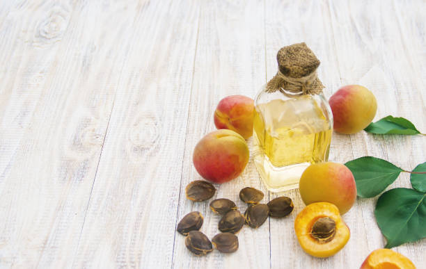 istock apricot oil in a small jar. selective focus. 1133382965