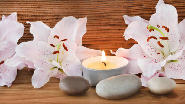 istock Wellness decoration stones with lilies and candles 1133384376