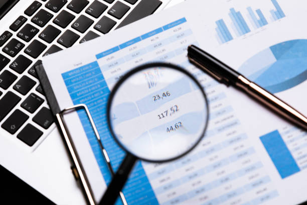istock Office workplace with magnifier and stationery 1133385592