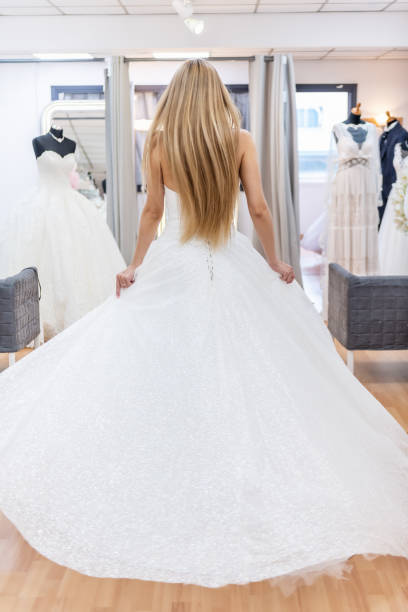 istock Bride walking in bridal shop 1133385598