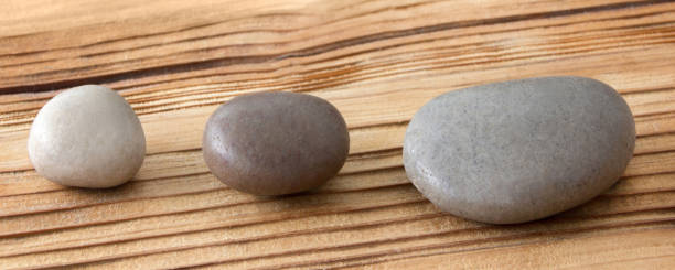 istock Stones and rustic wooden background 1133385777