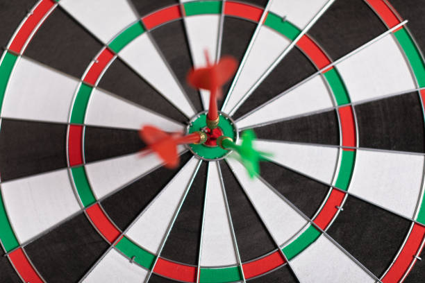 istock Three Darts hit red target on the target right close-up 1133385816