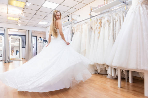 istock Playful bride dancing in bridal shop 1133386692
