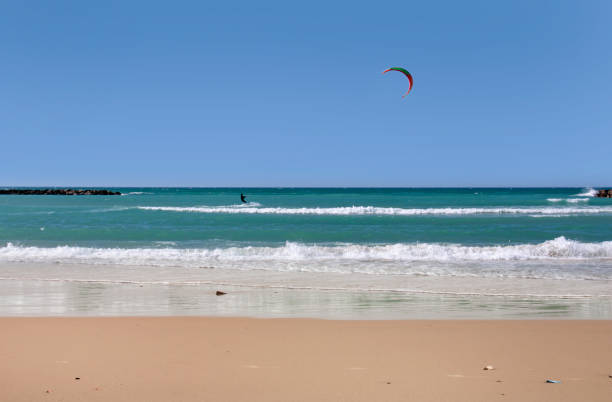istock Beach landscape with the kitesurfer as the background 1133386825