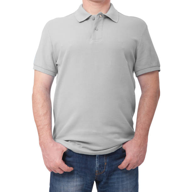istock Man wearing blank blue t-shirt on gray brick wall background with copy space. For mock up template design. Front view 1133387143
