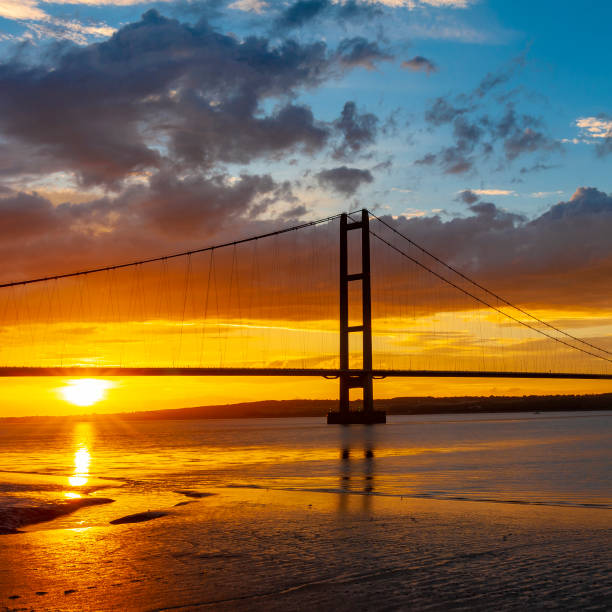 istock Deep orange sunset behind the iconic Humber Bridge in the UK. 1133388255