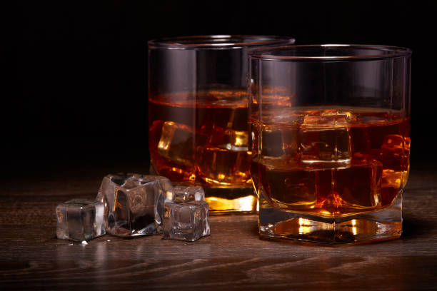istock Glasses of whisky with ices 1133389585