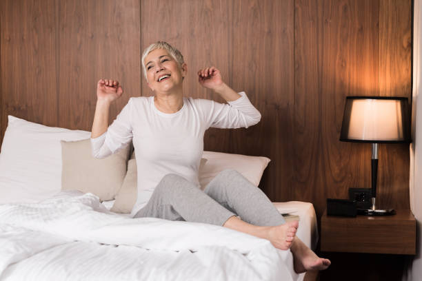 istock Mature woman waking up and stretching 1133389634