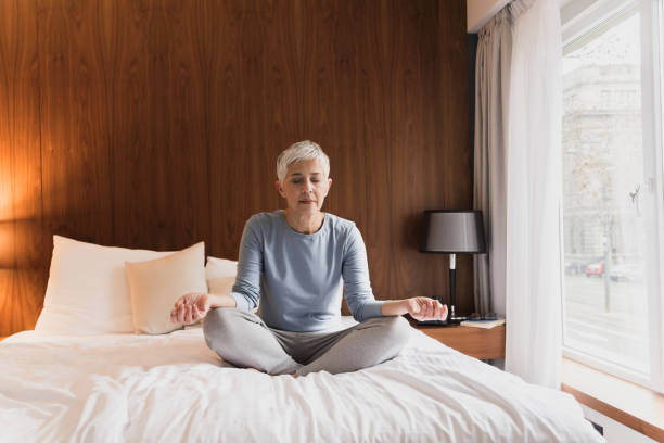 istock Mature woman meditating 1133389638