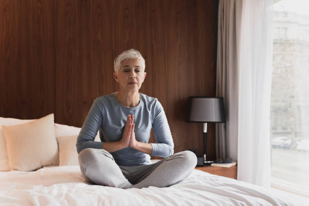 Mature woman meditating