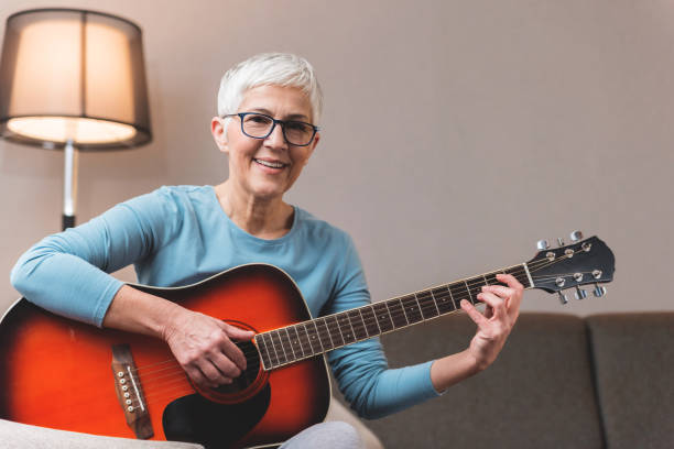 istock Mature woman playing guitar 1133389720