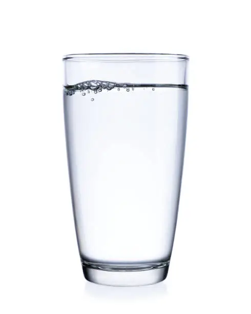 Water in glass isolated on white background.