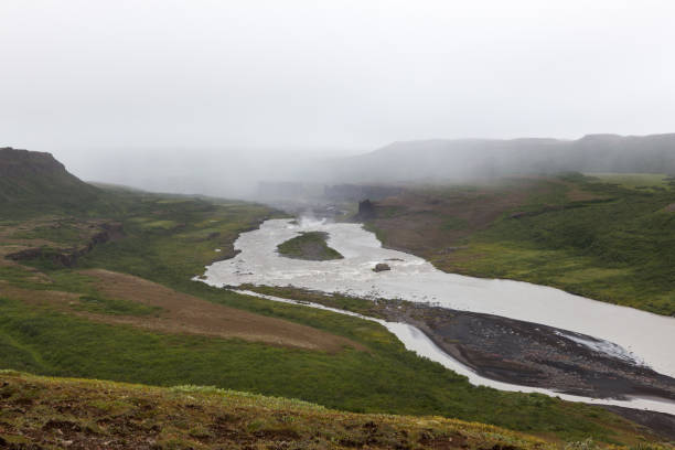 istock Iceland river landscape on a gray misty day. 1133390309