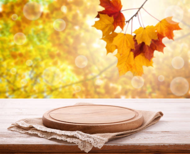 istock Pizza board with tableclothe on wooden desk. Autumn background. Top view mock up. Selective focus. 1133390455
