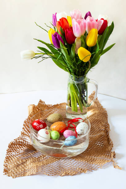 istock Tulip bouquet and easter eggs in bowl. 1133391534