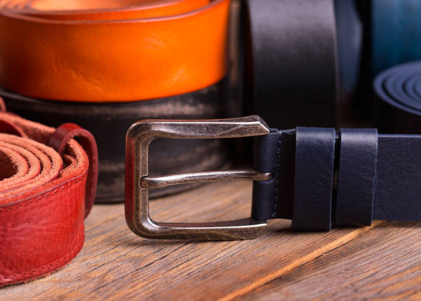 istock Collection of leather belts on a wooden table 1133397453