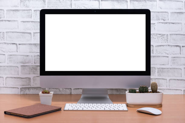 istock Blank screen of All in one Computer with tablet and cactus pot on wooden table 1133398864