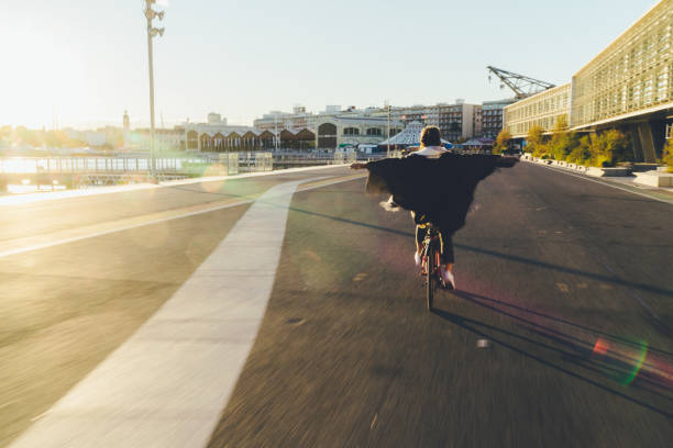 istock Carefree girl riding a bicycle on sunset 1133400781