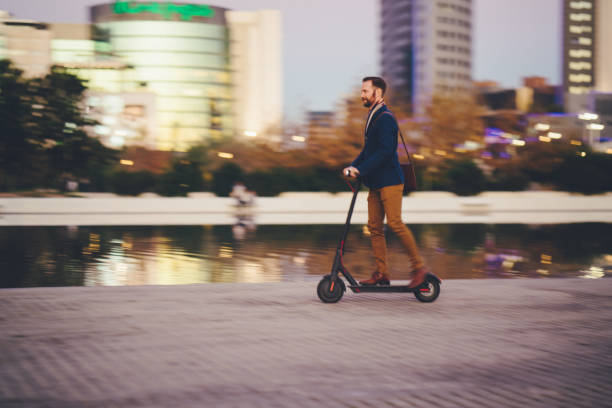 Businessman riding scooter in Spain