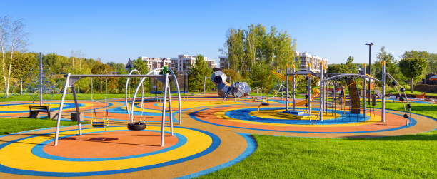 Panorama of colorful large playground in a city park stock photo
