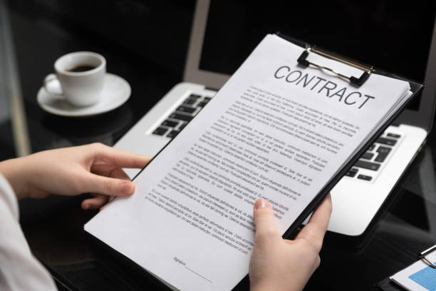 employee gets acquainted with contract in stylish office