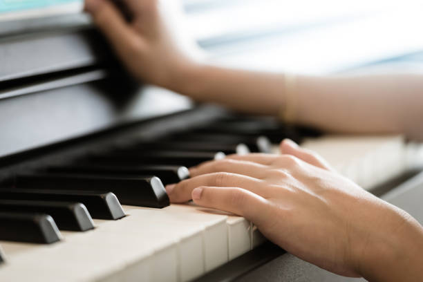 istock Child Hand playing Music keyboard electric piano 1133402645