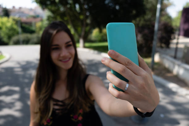 istock Girl taking selfie with smartphone blurred 1133402680