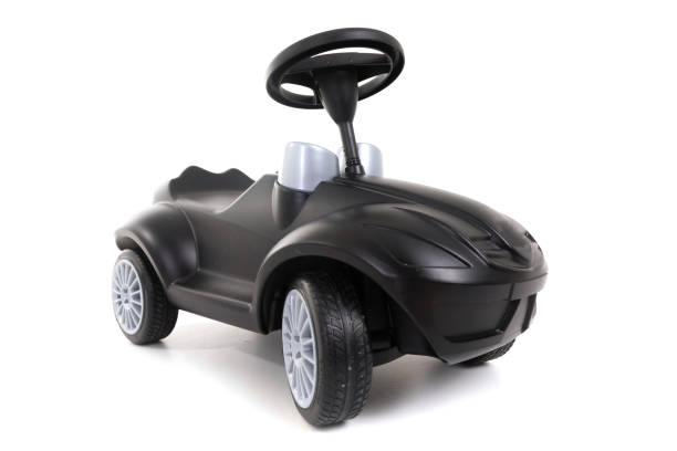 istock Black toy car isolated on white background 1133405471