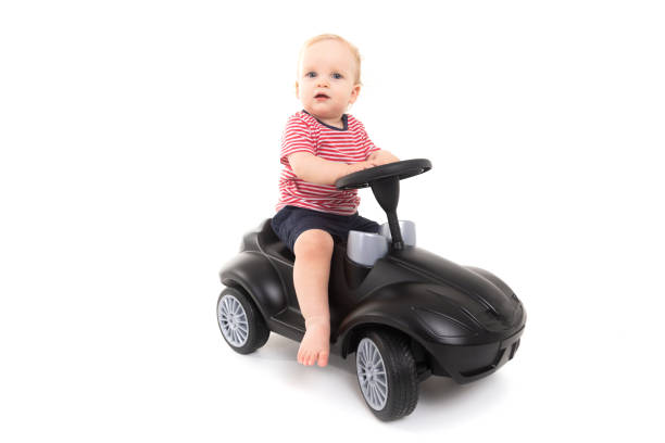 istock Child sitting on a gurney isolated on white background 1133405473