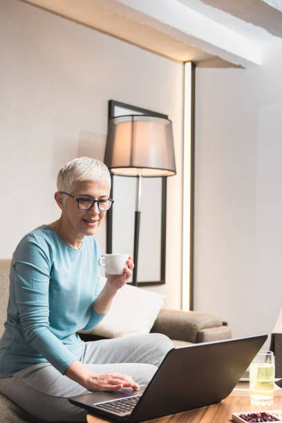 Mature woman working on her laptop