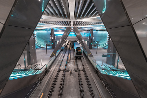 Escalators surrounded by bare rock at Rådhuset subway station, Stockholm.