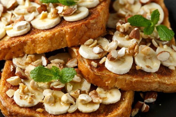 istock French cinnamon toast with banana, nuts and hazelnut, honey. 1133407634