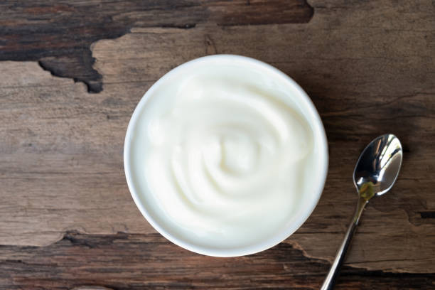 istock Yogurt  In white glass wood background. 1133408550