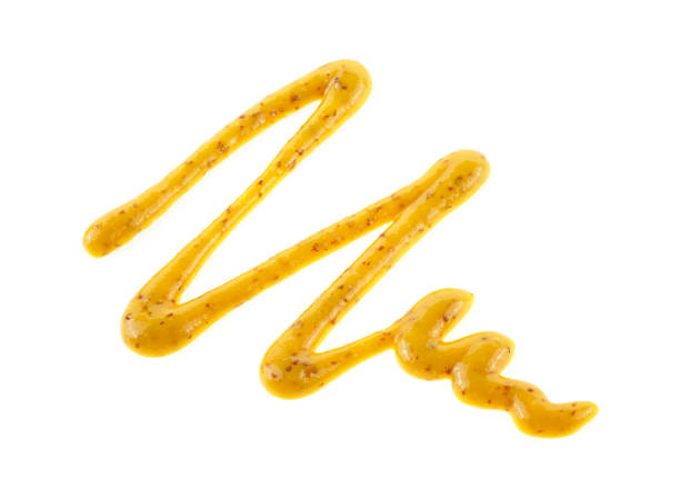 istock Yellow mustard sauce, spread isolated on white background.  Zig-zag form. 1133408686