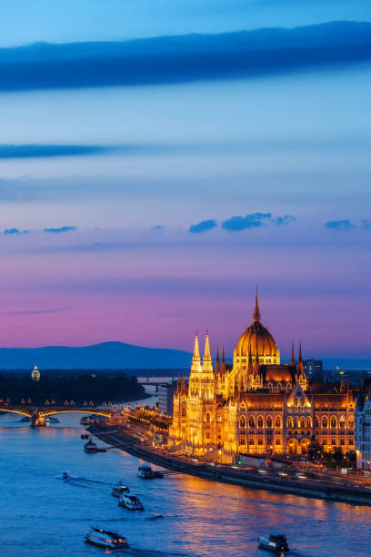 Evening in Budapest Budapest in the evening, Hungarian Parliament Building at Danube river, capital city of Hungary hungary stock pictures, royalty-free photos & images