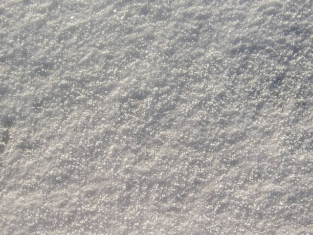 Winter nature festive background: Winter landscape with brilliant snow in the sunlight Winter Nature pattern made by the frost and snow: Frosty pattern on ice covered with crust snow with space for text or image for winter design crud stock pictures, royalty-free photos & images