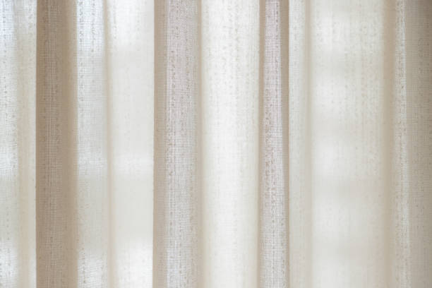 istock Close-up macro texture of a curtain with bright light 1133412037