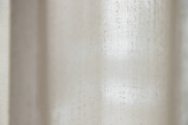 istock Close-up macro texture of a curtain with bright light 1133412064