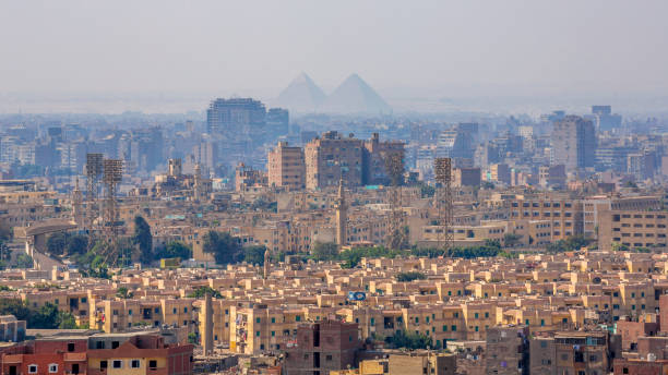 Pyramids silhouettes over Cairo, Egypt Pyramid, Pyramid Shape, Smog, Famous Place, Urban Skyline cairo photos stock pictures, royalty-free photos & images