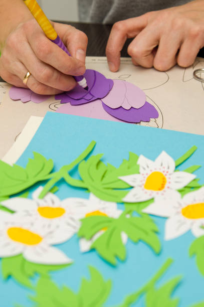 istock Woman doing paper cutouts 1133412745