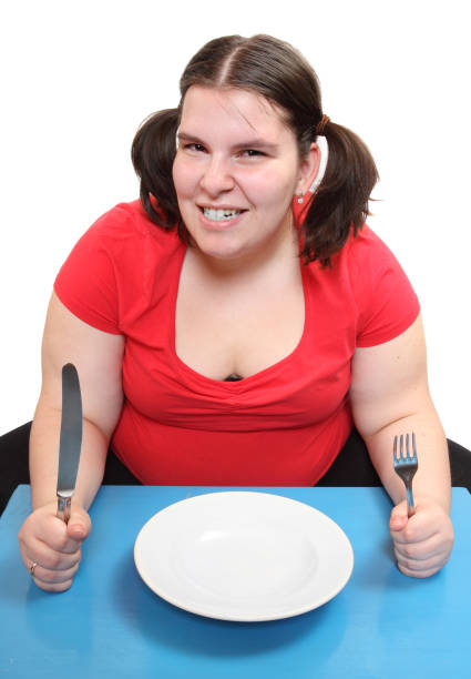 배고픈 뚱뚱한 여자와 빈 접시. - eating disorder bulimia gag weight 뉴스 사진 이미지