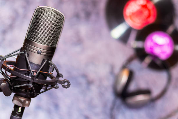 istock microphone, headphone and vinyl record. music background 1133413479