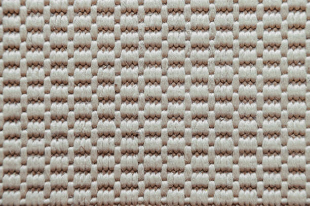 Close-up macro of beige fabric texture